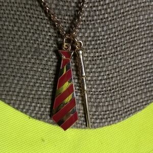 Goldtone red tie wand jcm necklace